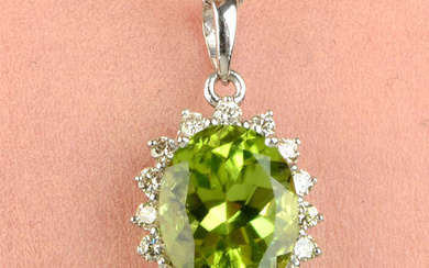 An 18ct gold peridot and brilliant-cut diamond pendant, with 18ct gold chain.