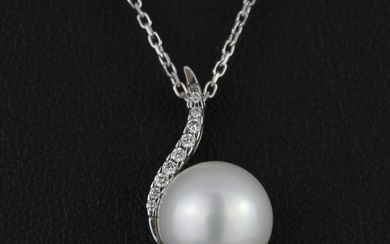 An 18ct white gold pendant set with a cultured pearl and diamonds on an 18ct white gold chain, L. 42cm.
