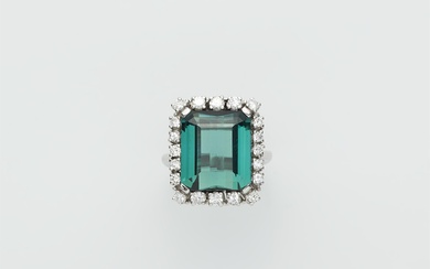 An 18k white gold diamond and green tourmaline cluster ring.