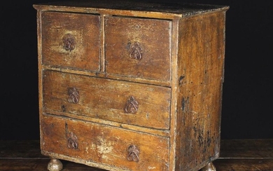 An 18th Century Miniature Painted Chest of Drawers. The two short and two long drawers fitted with i