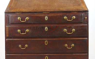 An 18th century oak bureau, the fall front with fitted...