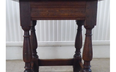 An 18thC style, rustic oak joint stool with a dowelled top, ...