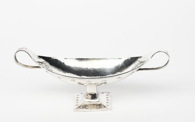An A E Jones silver footed dish, model no.552A, boat-shaped twin-handled bowl with applied strap