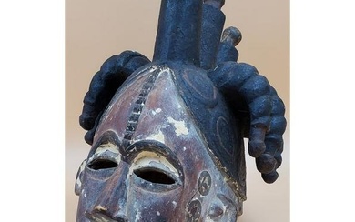 An African Igbo Polychrome Wood Maiden Spirit Mask