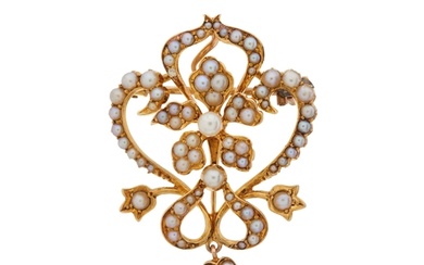 An Edwardian gold seed and split pearl floral openwork penda...