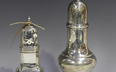 An Edwardian silver baluster sugar caster with pierced domed lid and spiral finial, on a circular st