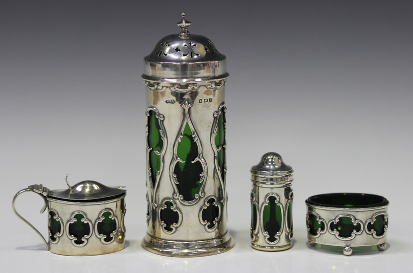 An Edwardian silver sugar caster of cylindrical form with pierced domed cover, the sides pierced wit