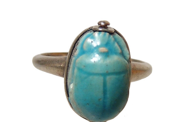 An Egyptian faience scarab in silver ring