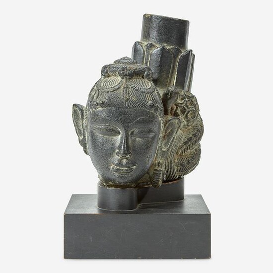 An Indian carved black stone head of a female