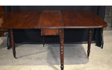 An antique mahogany drop leaf dining table 71 x 145 x 104 cm...