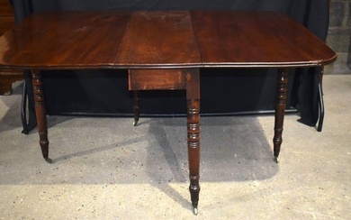 An antique mahogany drop leaf dining table 71 x 145 x 104 cm.
