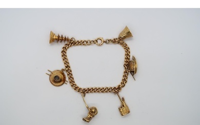 An approx 14ct yellow gold charm bracelet with 6 charms, app...