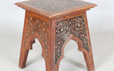 An early 20th century Continental Art Nouveau walnut square occasional table, the top and arched sid