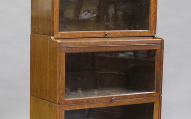 An early 20th century Globe Wernicke style oak three-section bookcase, height 147cm, width 87cm, dep