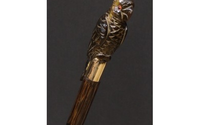 An early 20th century novelty walking stick, the horn handle...