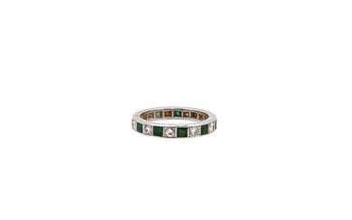 An emerald and diamond full eternity ring