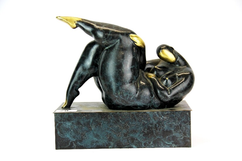 An interesting patinated bronze/brass sculpture of a naked woman, 25 x 12 x 25cm.