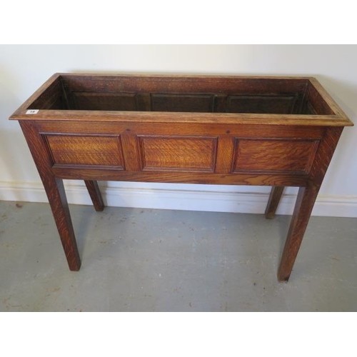 An oak planter with three panel front, 72cm tall x 95cm x 34...