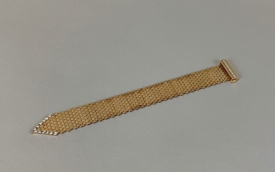 Bracelet ceinture en or jaune 18k et platine, à maillons formant des écailles articulées, terminé...