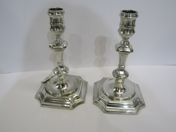 CAST SILVER CANDLESTICKS, a pair of Elizabeth II cast silver...