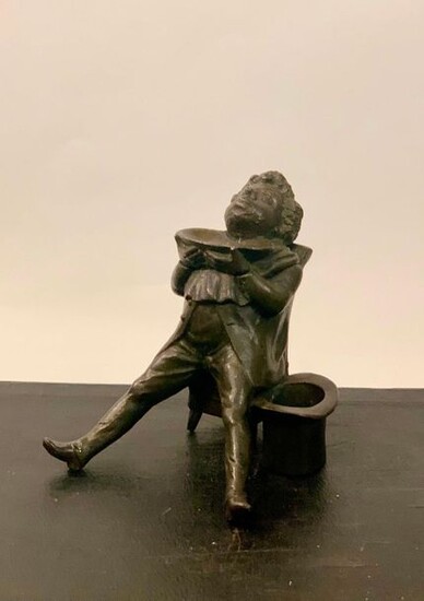 Cast iron inkwell imitating bronze, depicting a man at the barber's. Height 12 cm