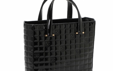 SOLD. Chanel: A CC logo hand bag of black quilted patent leather with two handles,...