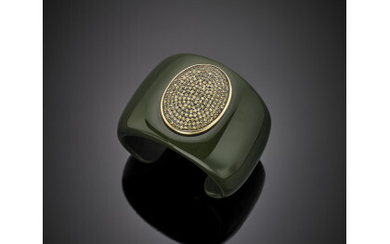 EVANUEVA Plastic cuff bracelet with a white gold green gem set pavé central, g 84.85, diam. cm 5.70.Read more