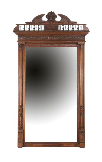 (-), Faceted mirror in an oak frame with...
