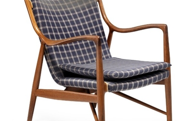Finn Juhl: “FJ 45”. A teak easy chair. Sides, back and loose seat cushion upholstered with blue checkered wool. Made by Niels Vodder.