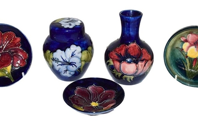 Five pieces of Moorcroft pottery, to include a Hibiscus...