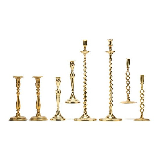 Four Pairs of Antique Brass Candlesticks