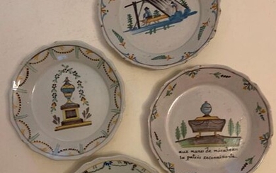 Four plates with revolutionary decoration in Nivernais earthenware.
