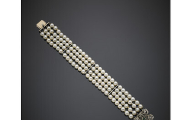 Four strand cultured pearl bracelet with white gold diamond and emerald clasp and white gold spacers, g 41.53, length cm…Read more