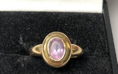 Gold ring set with an amethyst. P. 3...
