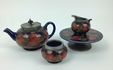 Group of Moorcroft pomegranate pewter mounted tablewares - teapot, milk jug, Tarza, rosebowl