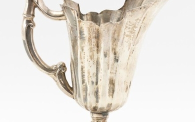ITALIAN SILVER EWER With shaped rim, wide angular flutes, knopped stem and molded foot. City mark and another illegible mark. Height...