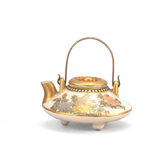 JAPANESE MINIATURE SATSUMA POTTERY TEAPOT In squat ovoid form, with floral design. Black mark signature on base. Diameter 1.8".