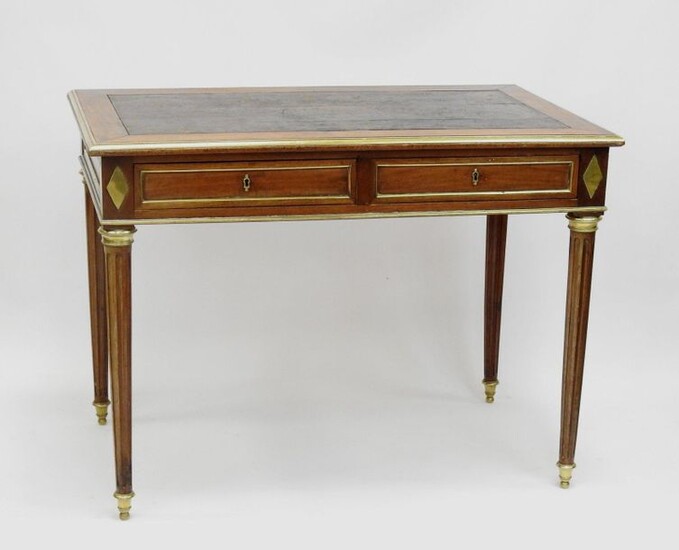 Mahogany FLAT OFFICE opening by two drawers in belt. It rests on four fluted feet. Gilt bronze ornamentation. Louis XVI style, early 19th century. 74 x 100 x 60 cm. (wears)