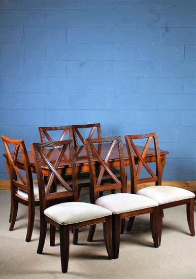 Mahogany effect extending dining table, with one extra leaf and a set of six matching chairs, the