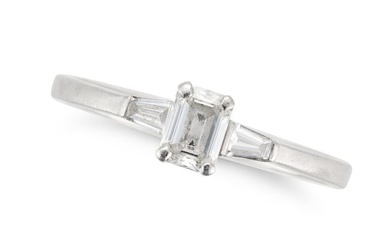 NO RESERVE - A SOLITAIRE DIAMOND RING in platinum, set with an emerald cut diamond between two