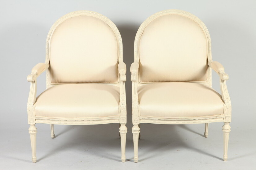 PAIR LOUIS XVI STYLE CARVED AND CREAM PAINTED DOMED BACK...