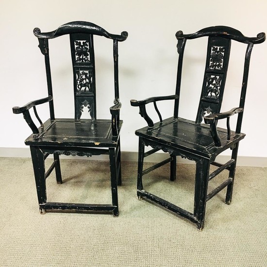 Pair of Black-painted Yoke-back Armchairs, China, late 19th/early 20th century, carved crest rails, openwork splats decorated with flow