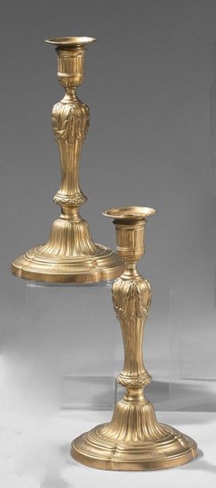 Pair of chased bronze torches; the bobèches with...