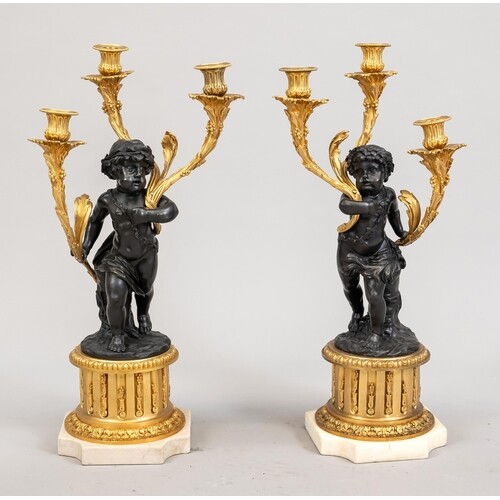 Pair of figural candelabra, 19th century, partly gilded and ...