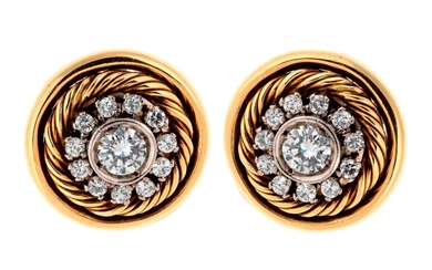 Pair of gold ear clips each centered with a diamond...