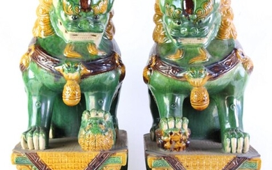 Pair of large Sancai glazed Buddhist lions seated on stepped pedestals (H61cm)