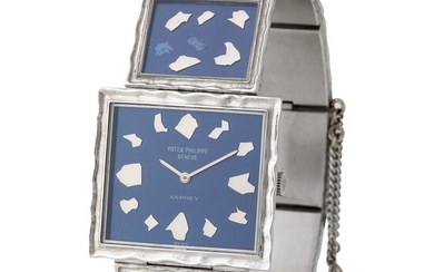 Patek Philippe. Absolutely Fine and Glamorous Nugget Rectangular shape Wristwatch in White Gold, Reference 4121, Retailed by Asprey and Extract from Archives