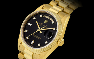 ROLEX, GOLD DAY-DATE WITH BLACK DIAL, REF. 18238