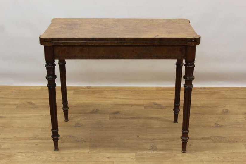 Rare Victorian burr walnut card table by Gillow & Co, rectangular fold over top with projecting angles, enclosing baize lined interior with dished corners, supported by pull out rear section, raise...