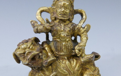 SMALL SINO TIBETAN GILT BRONZE BUDDHA RIDING LION- 17/18TH CENTURY